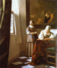 lady writing letter with her maid